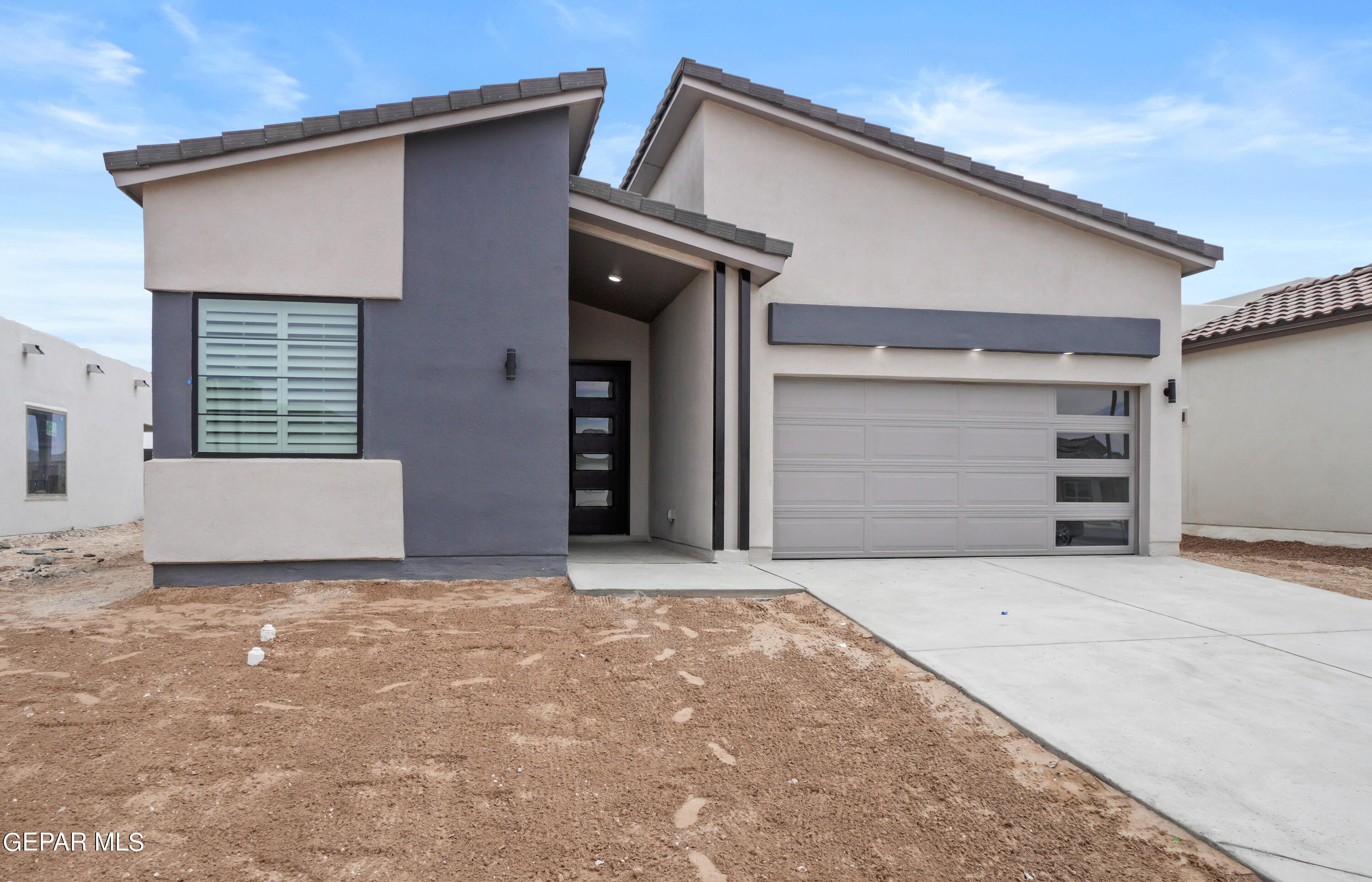 a front view of a house with a garage