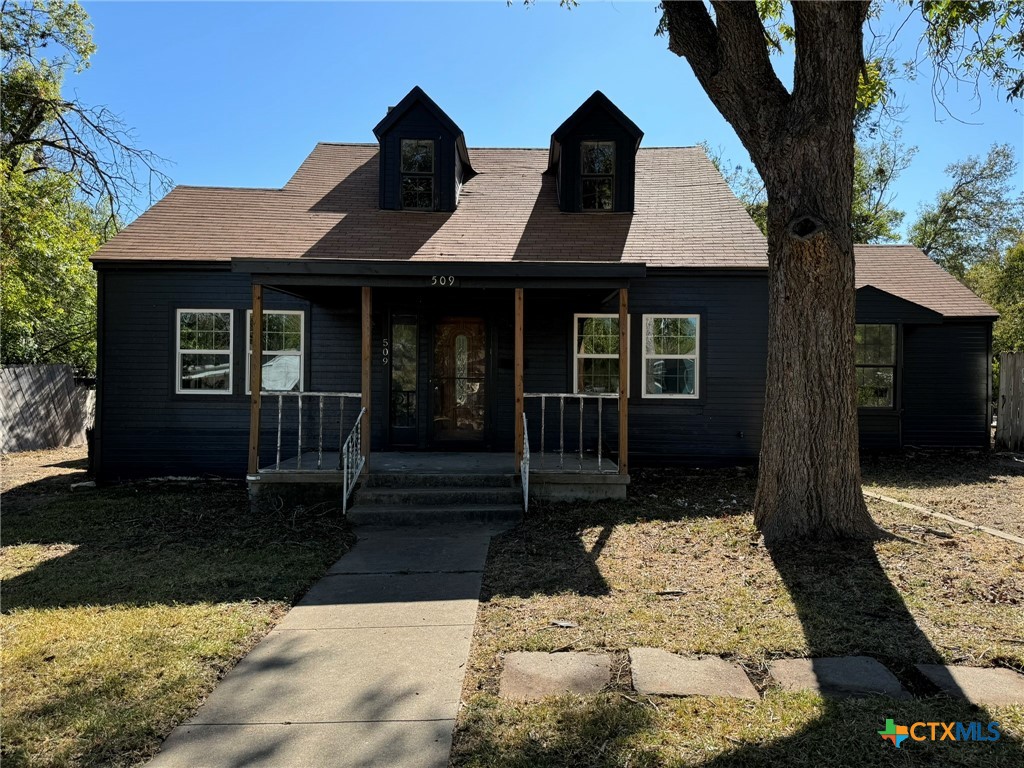 a view of house with yard