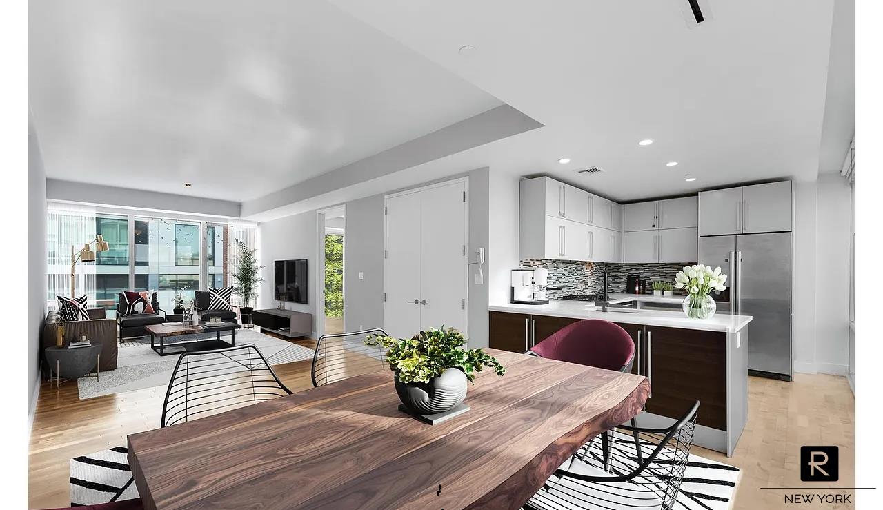 a kitchen with a table and chairs in it