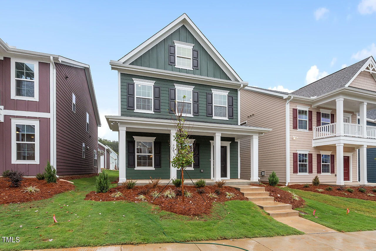 front view of residential houses with a yard