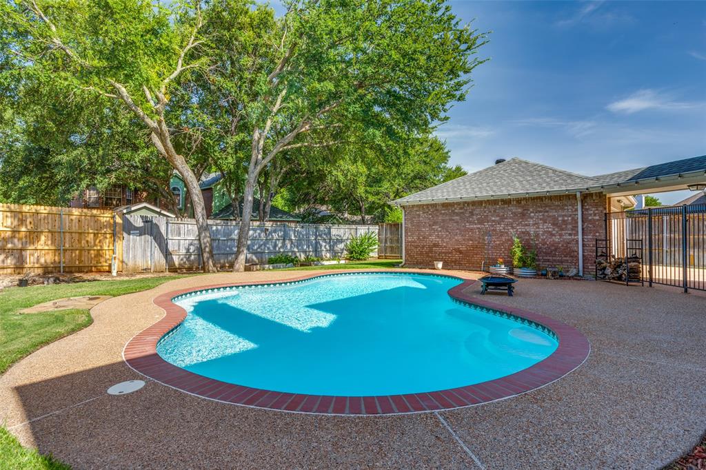 a view of a house with swimming pool and porch