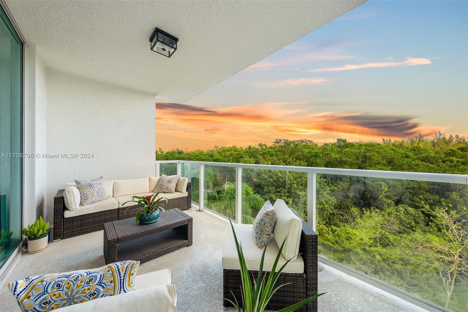 a view of a balcony with outdoor seating