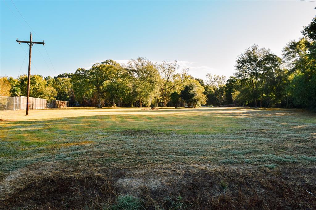 a view of a green yard with a house