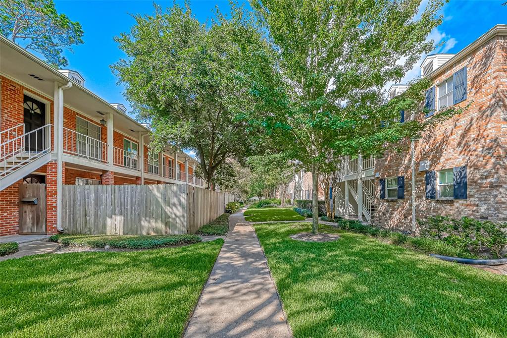 a view of a back yard of the house