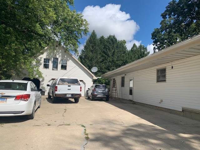 a view of car parked in front of house