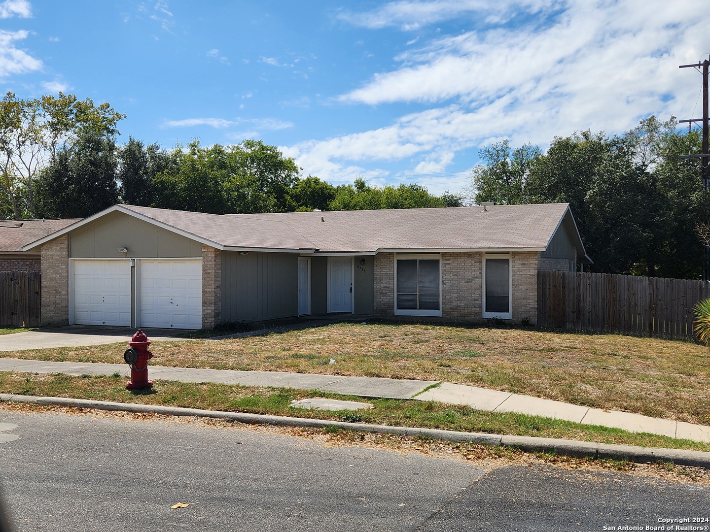 a house with yard in front of it