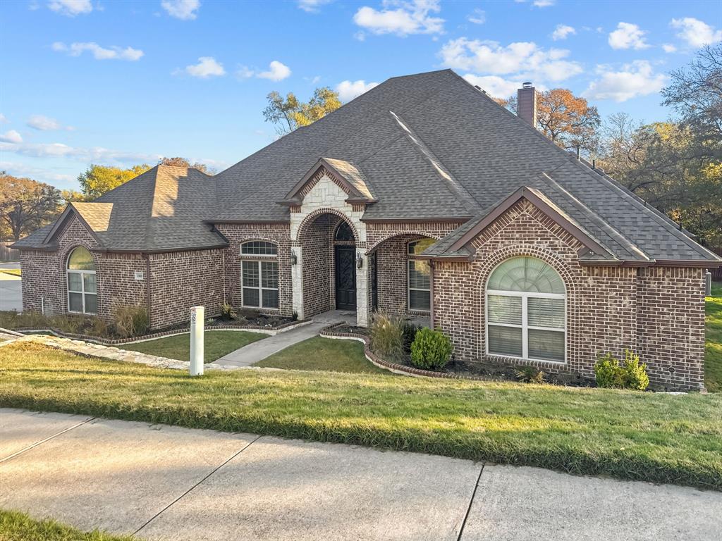 a front view of a house with a yard