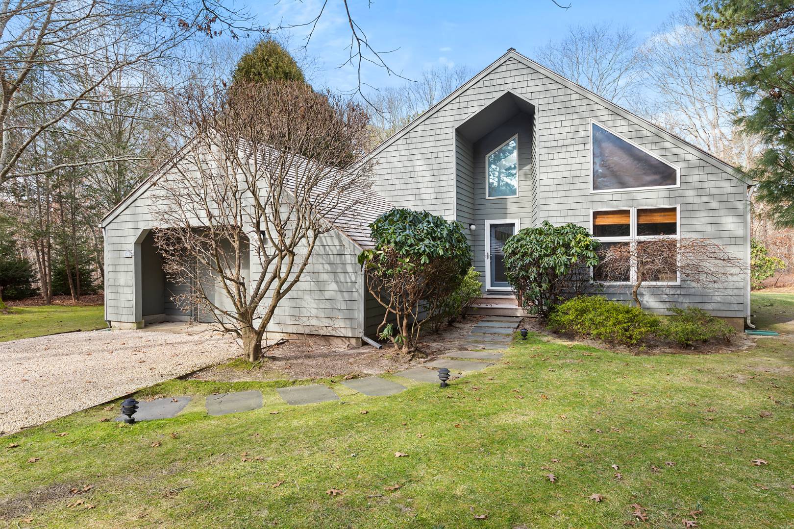 a front view of a house with garden