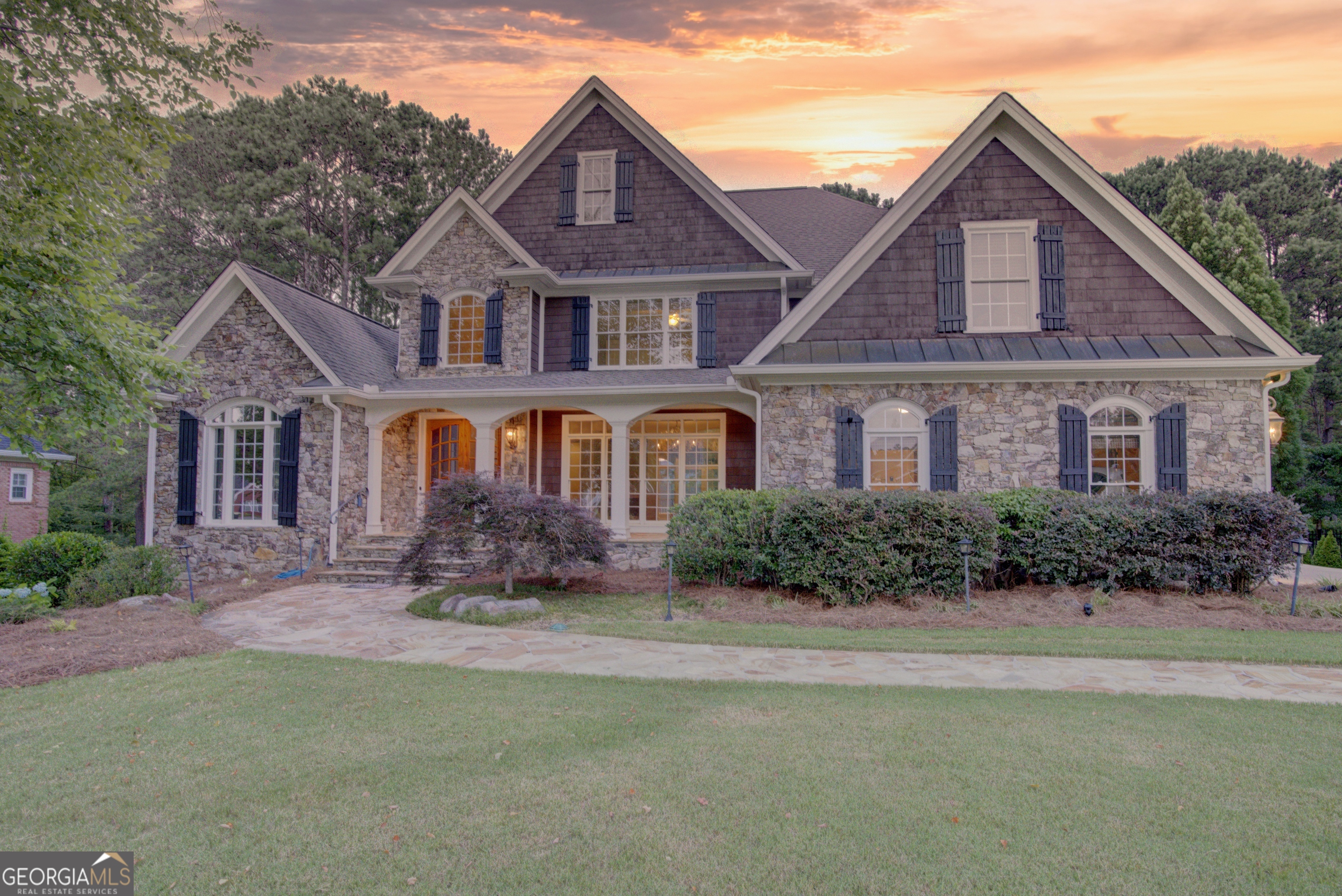 a front view of a house with a yard