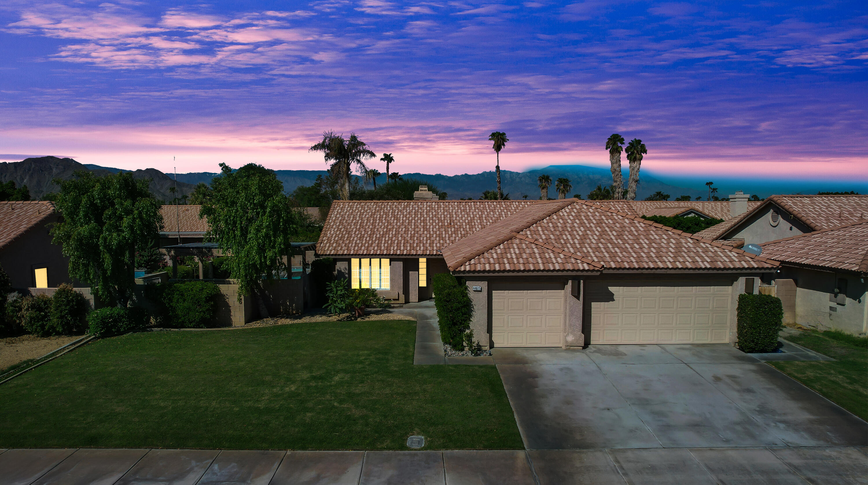 a aerial view of a house with a yard