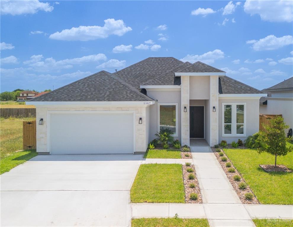 View of front of property with a front lawn