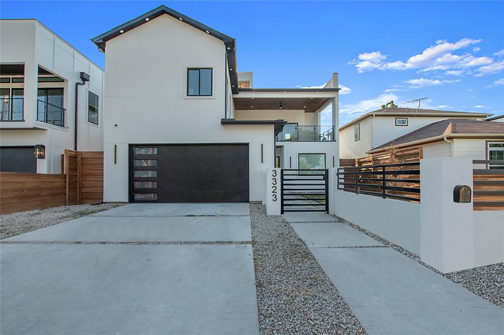 a front view of a house with garage