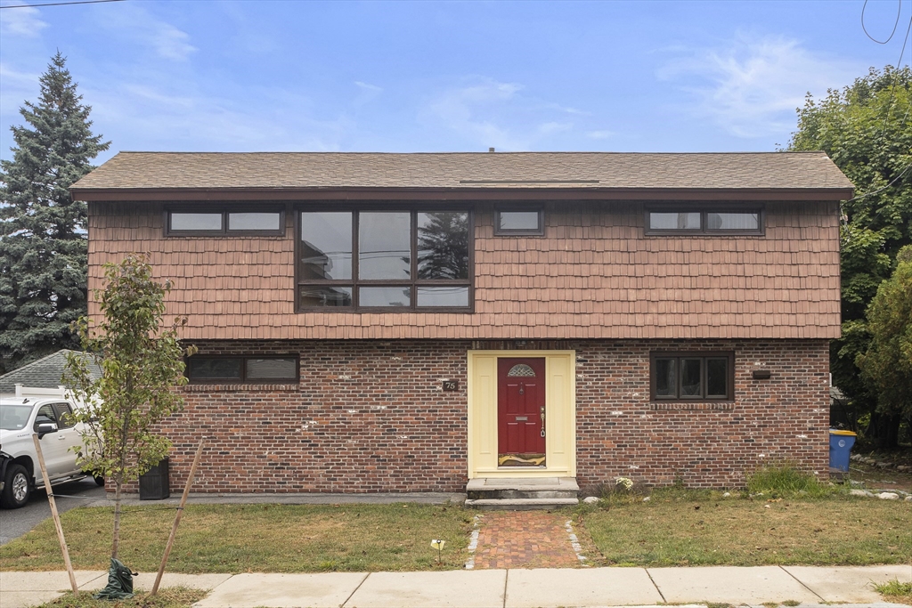 a front view of a house with a yard