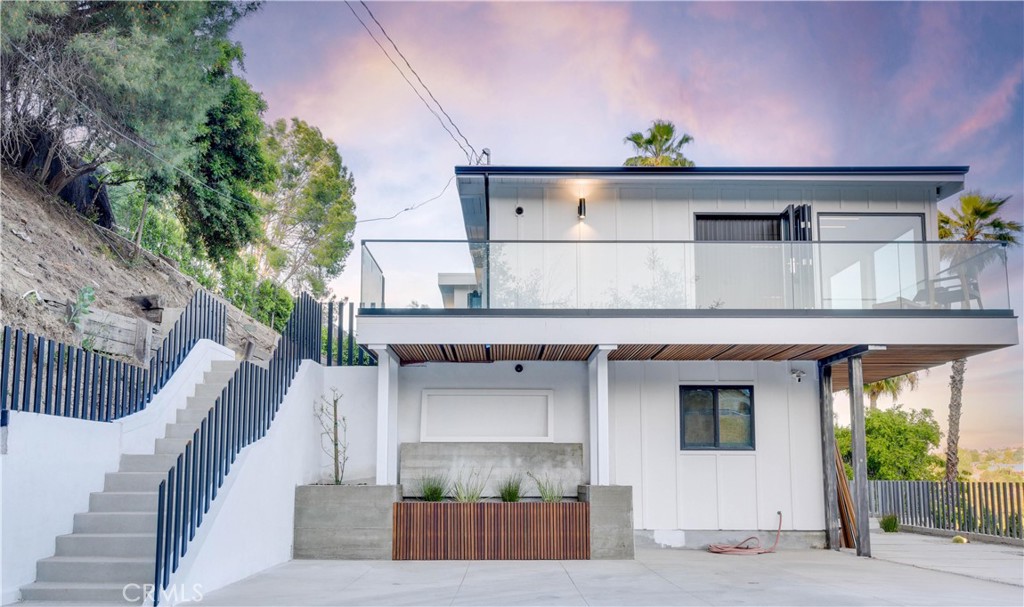 a front view of a house with deck