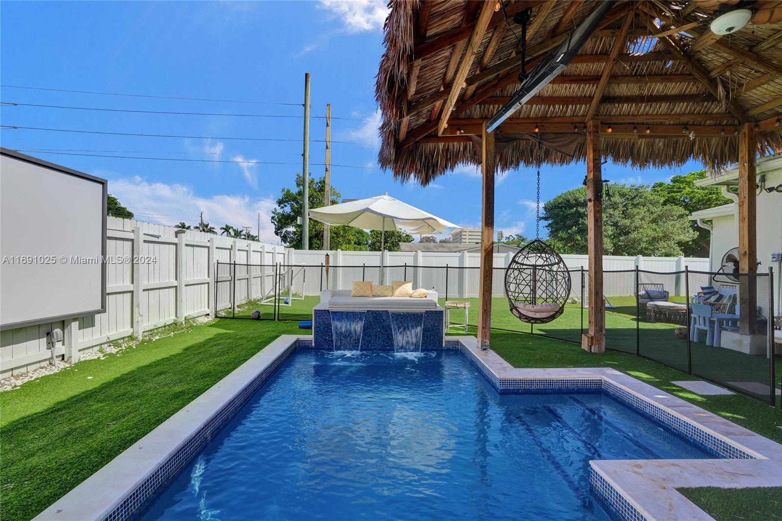 a view of a backyard with sitting area