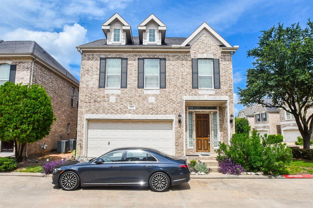 a car parked in front of a house