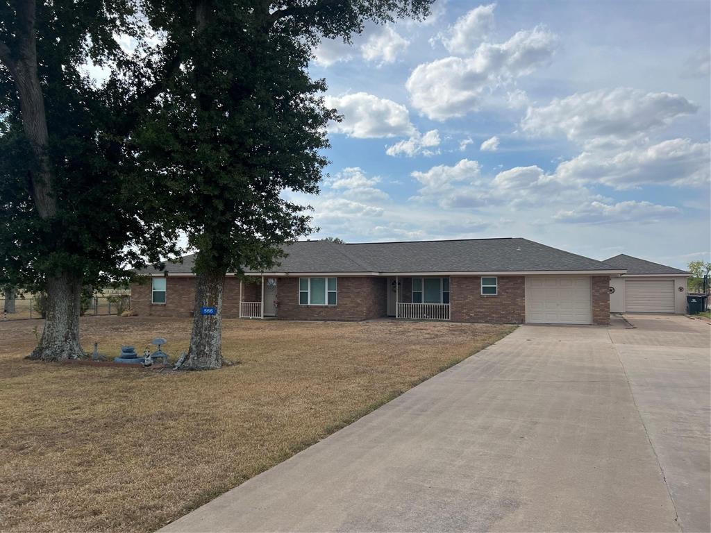 front view of a house with a dry yard