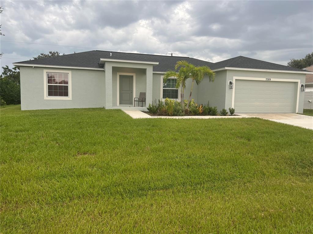 front view of a house with a yard