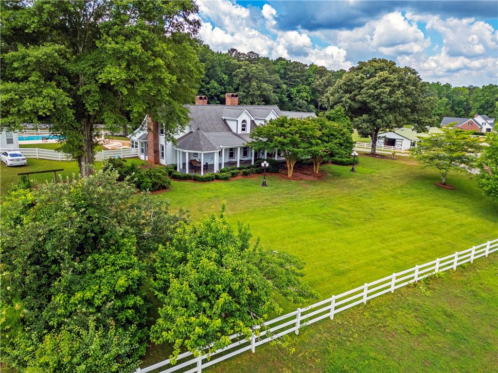 an aerial view of a house with a garden