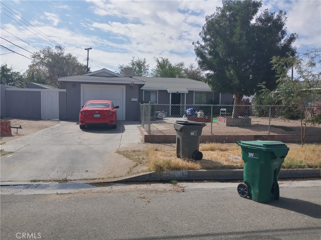 a view of a backyard with table and chairs