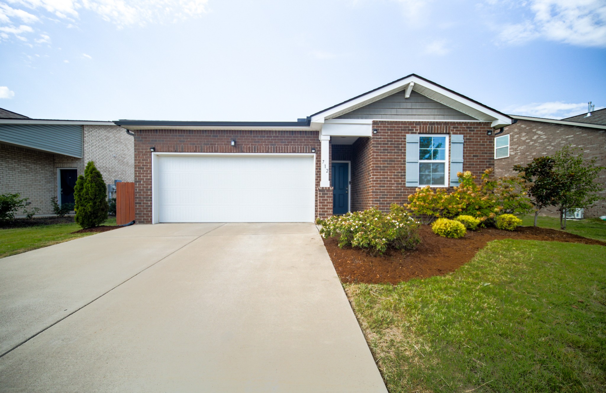 front view of a house with a yard