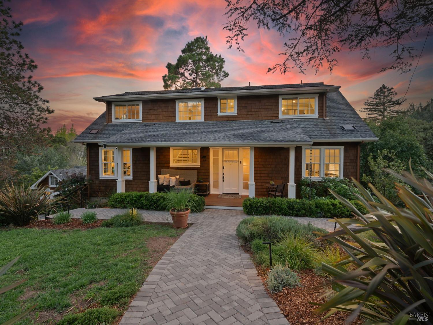 a front view of a house with garden