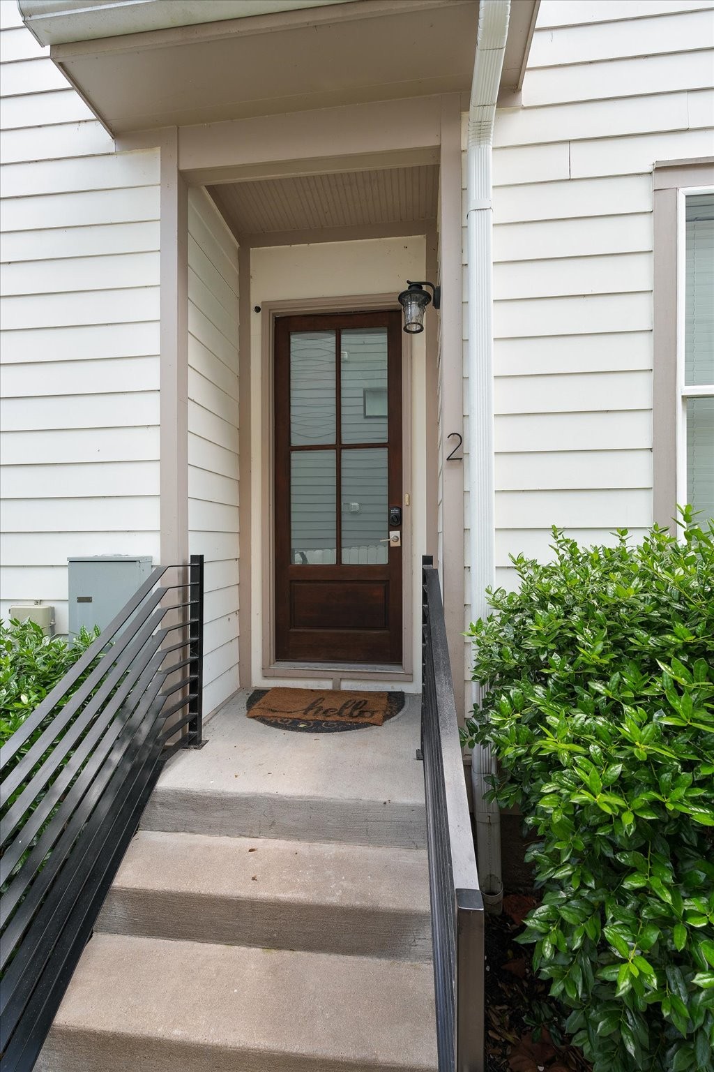 a view of a house with a door and wooden floor