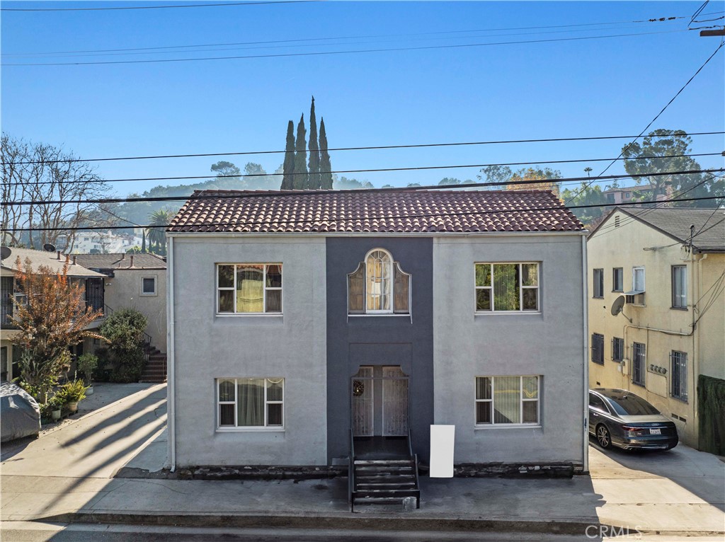 a front view of a house with parking