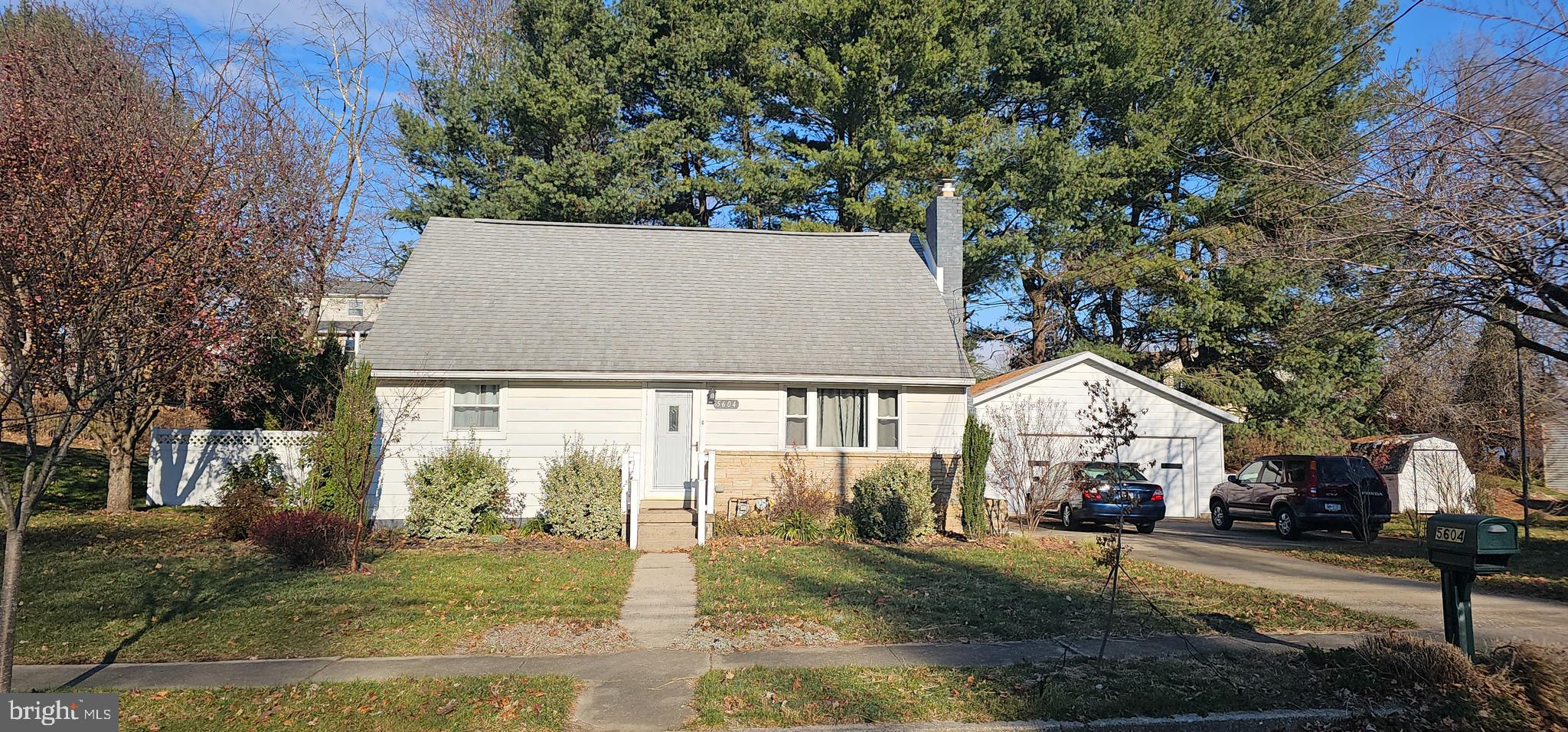 a view of house with yard