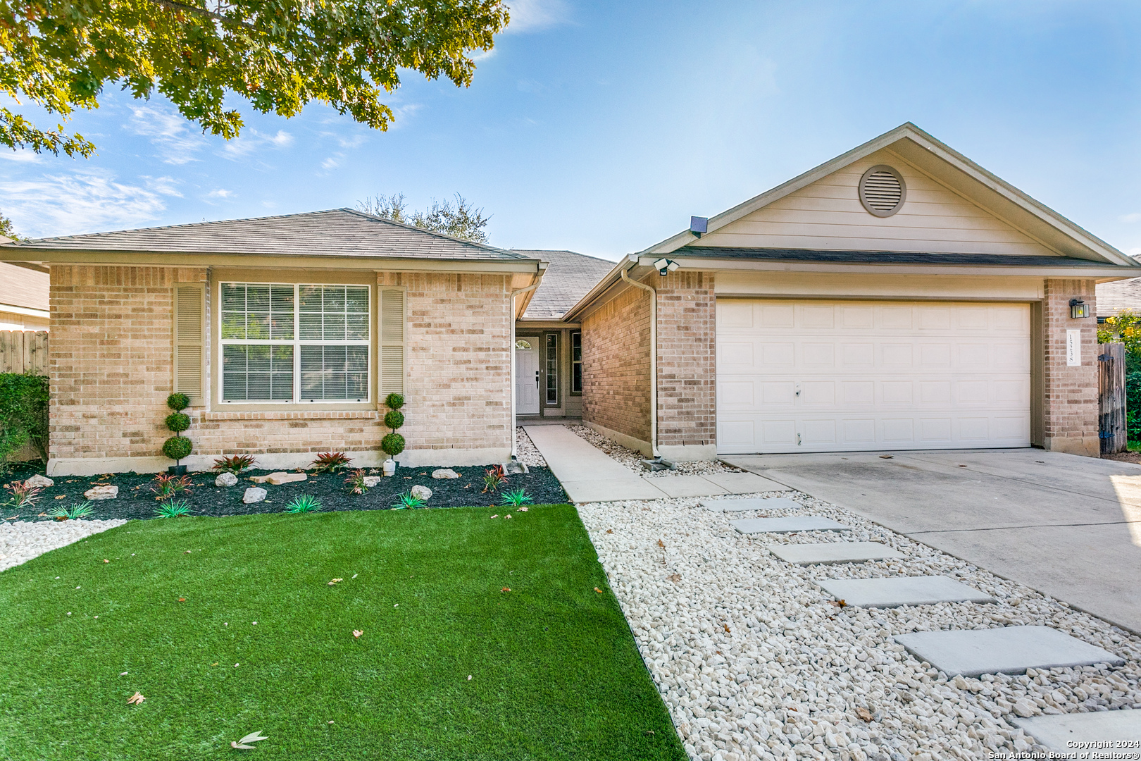 front view of a house with a yard