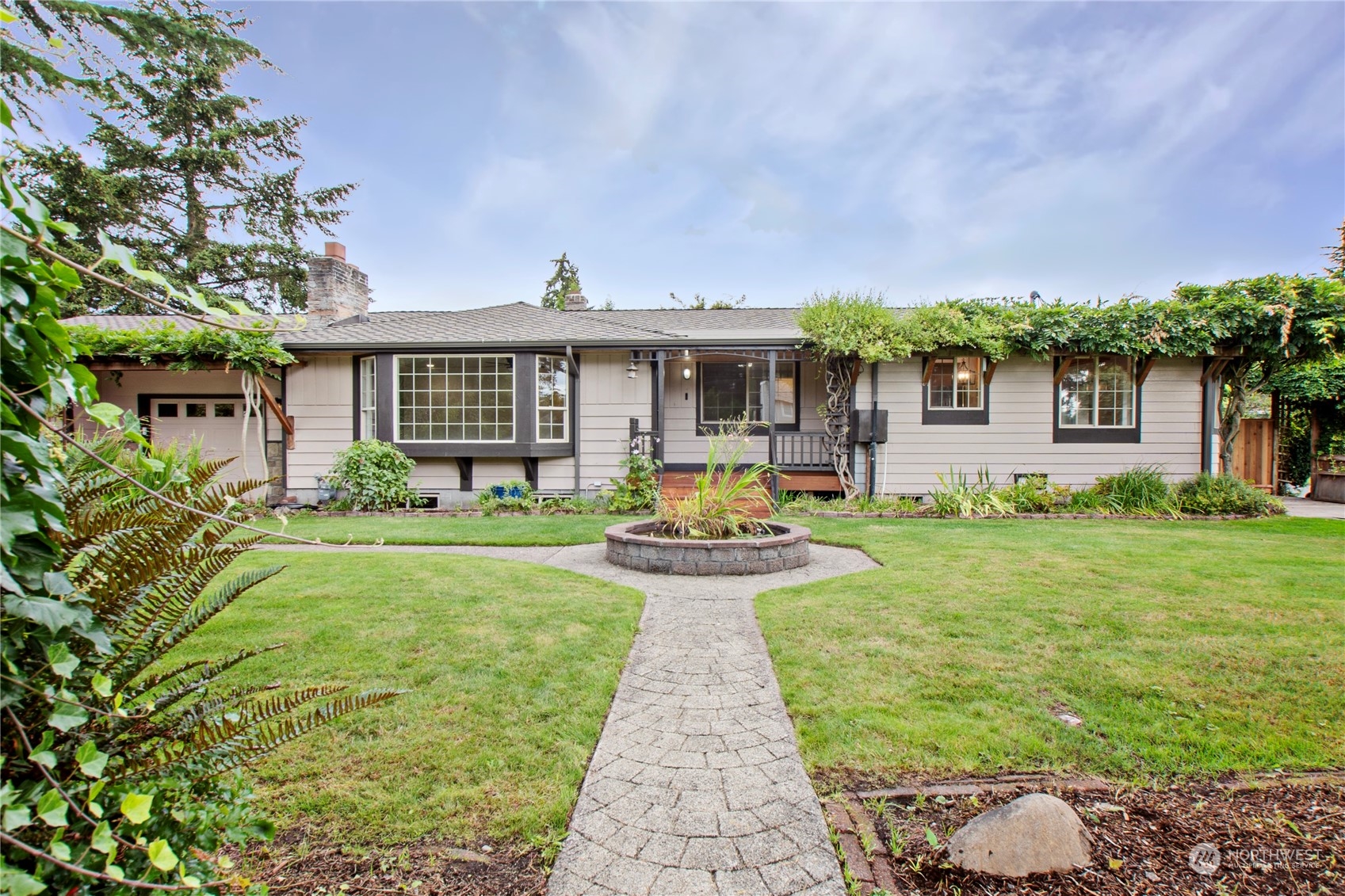 a front view of a house with garden