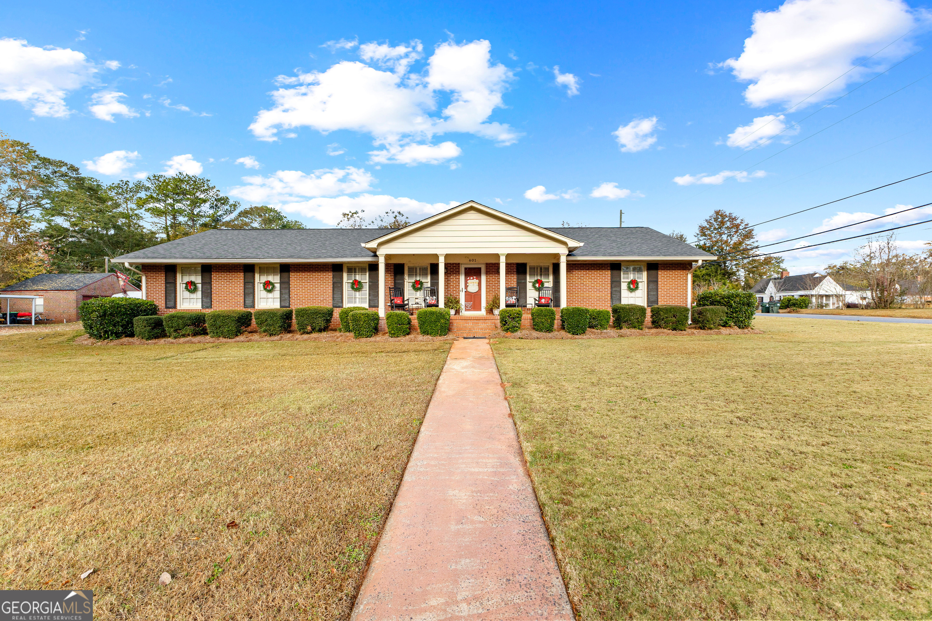 a front view of a house with a yard