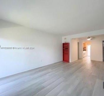 a view of empty room with a fireplace