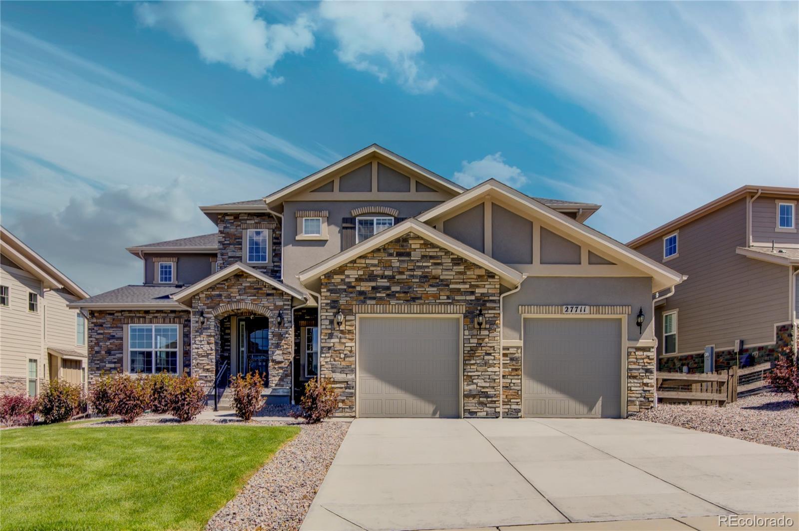 a front view of a house with a yard