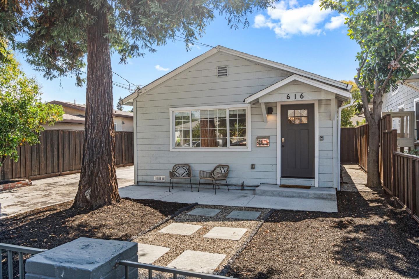 a front view of a house with yard