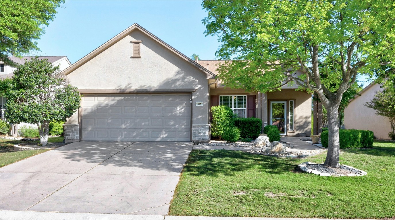 Lovely landscaping in both front and back yards of this Lamar plan home by Del Webb.