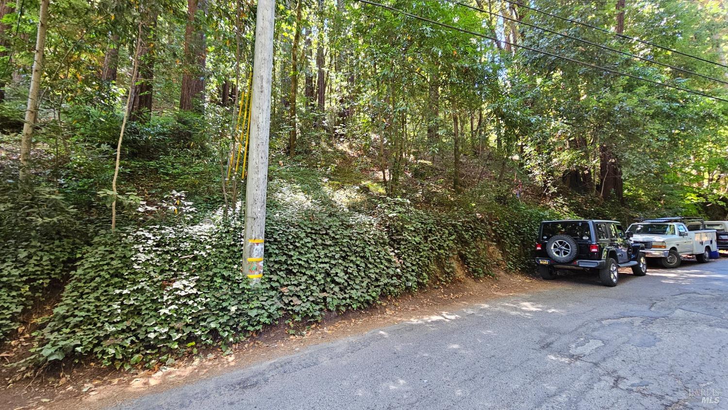 a view of a car parked on the side of the road