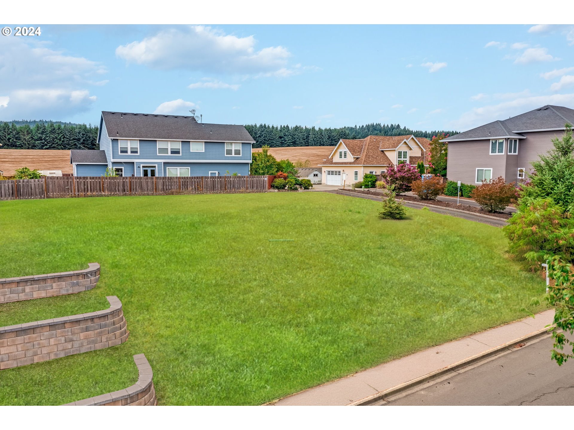 a view of yard with swimming pool and furniture