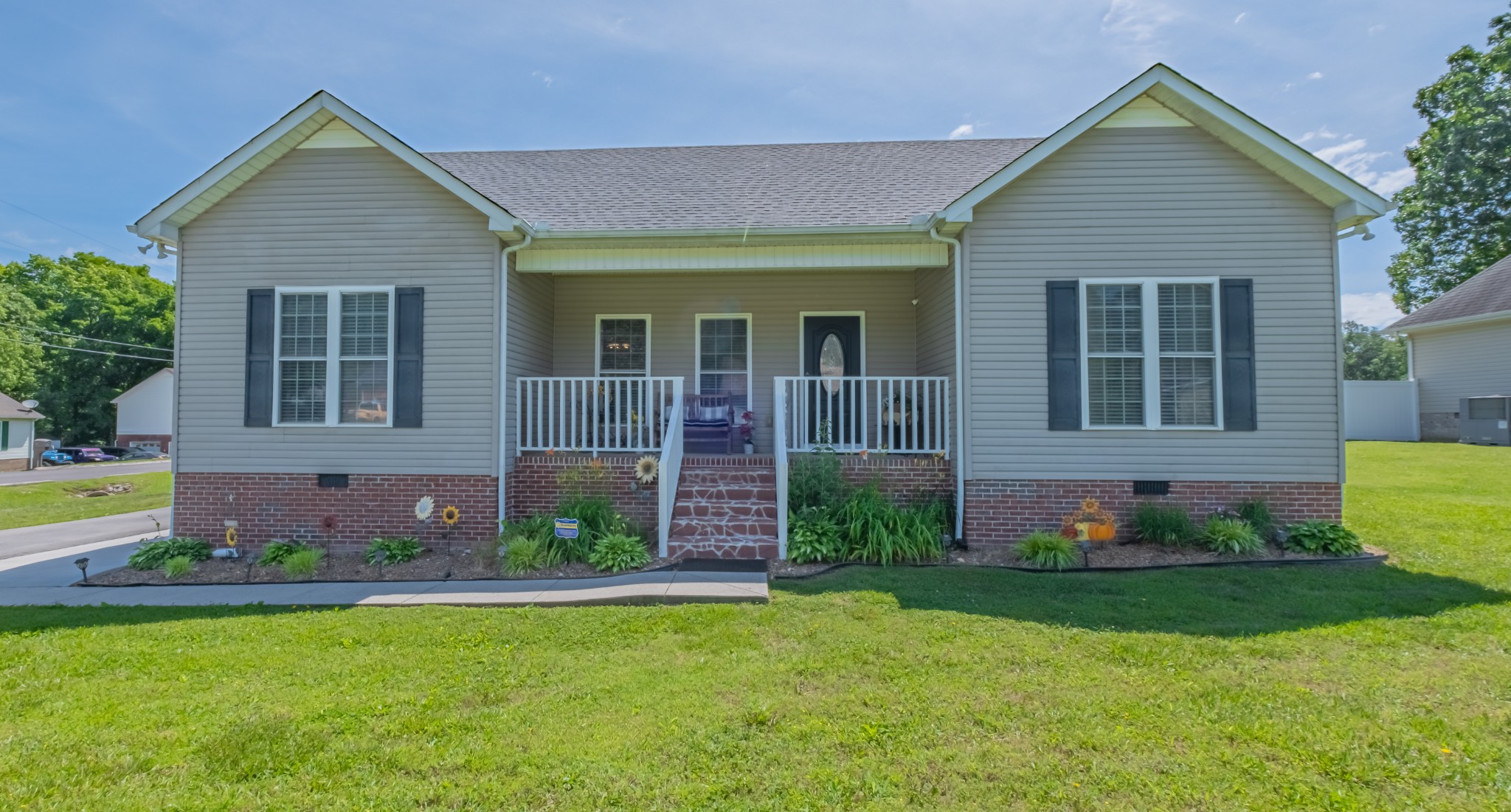 front view of a house with a yard