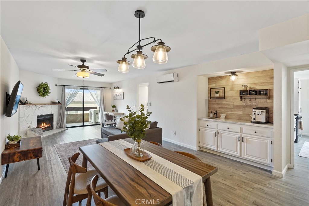 a view of a dining room with furniture wooden floor and chandelier