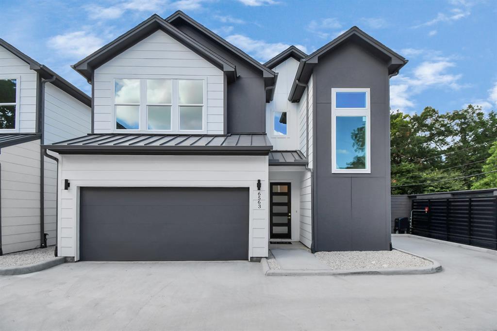 a front view of a house with a garage