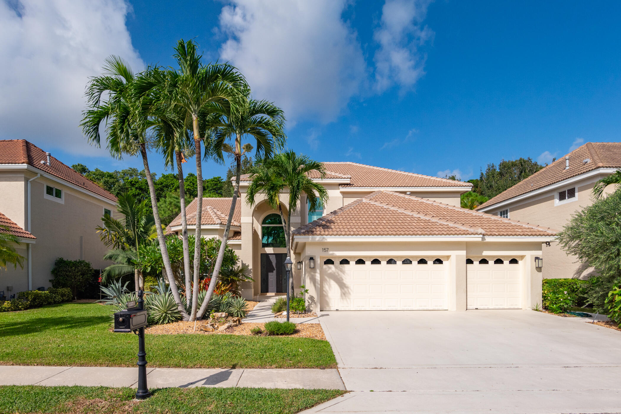 a front view of a house with yard