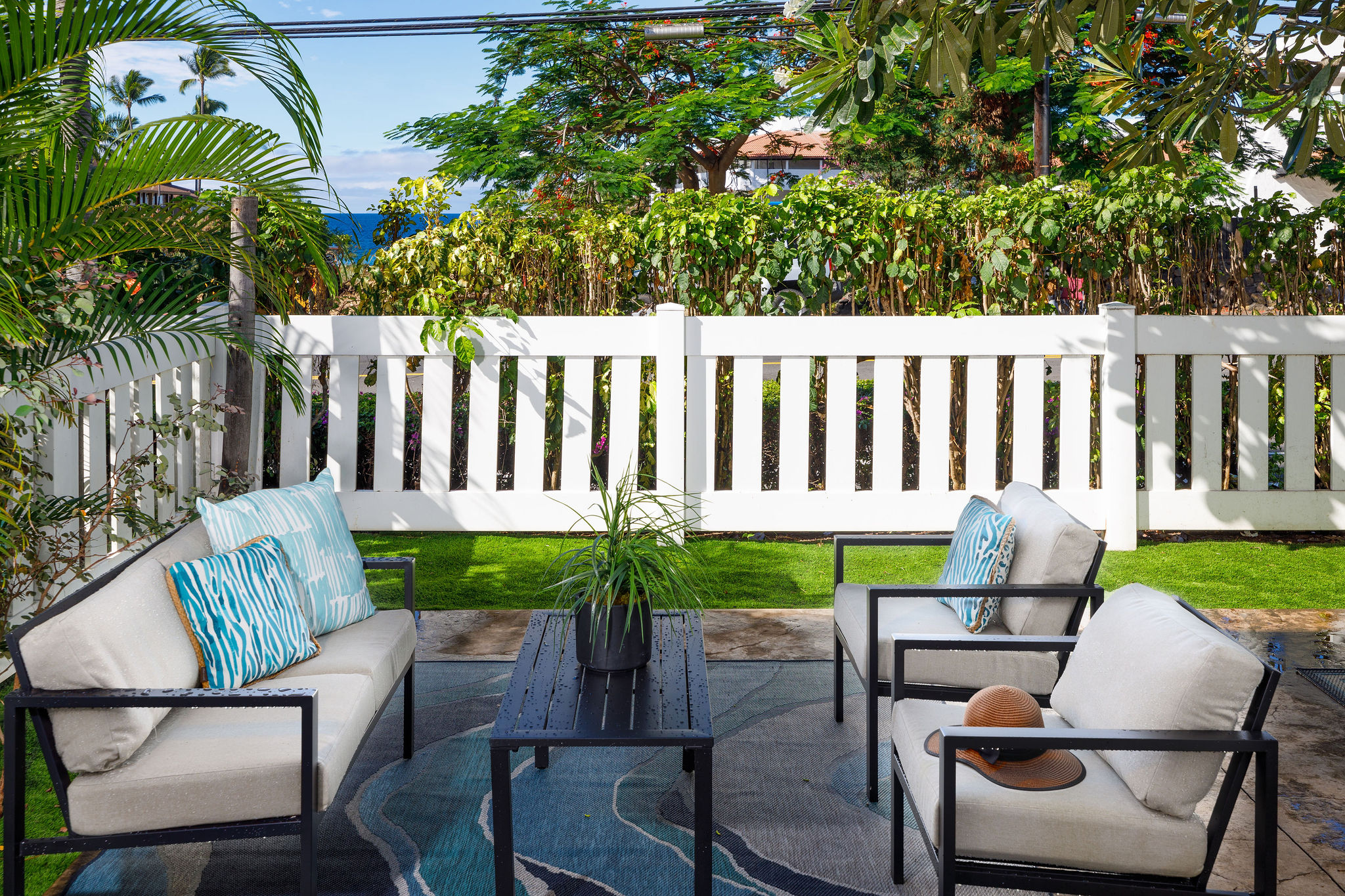 a backyard of a house with table and chairs