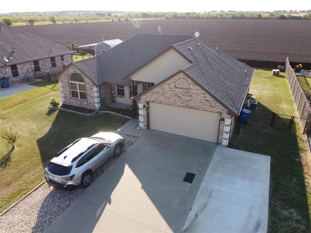 an aerial view of a house with a swimming pool