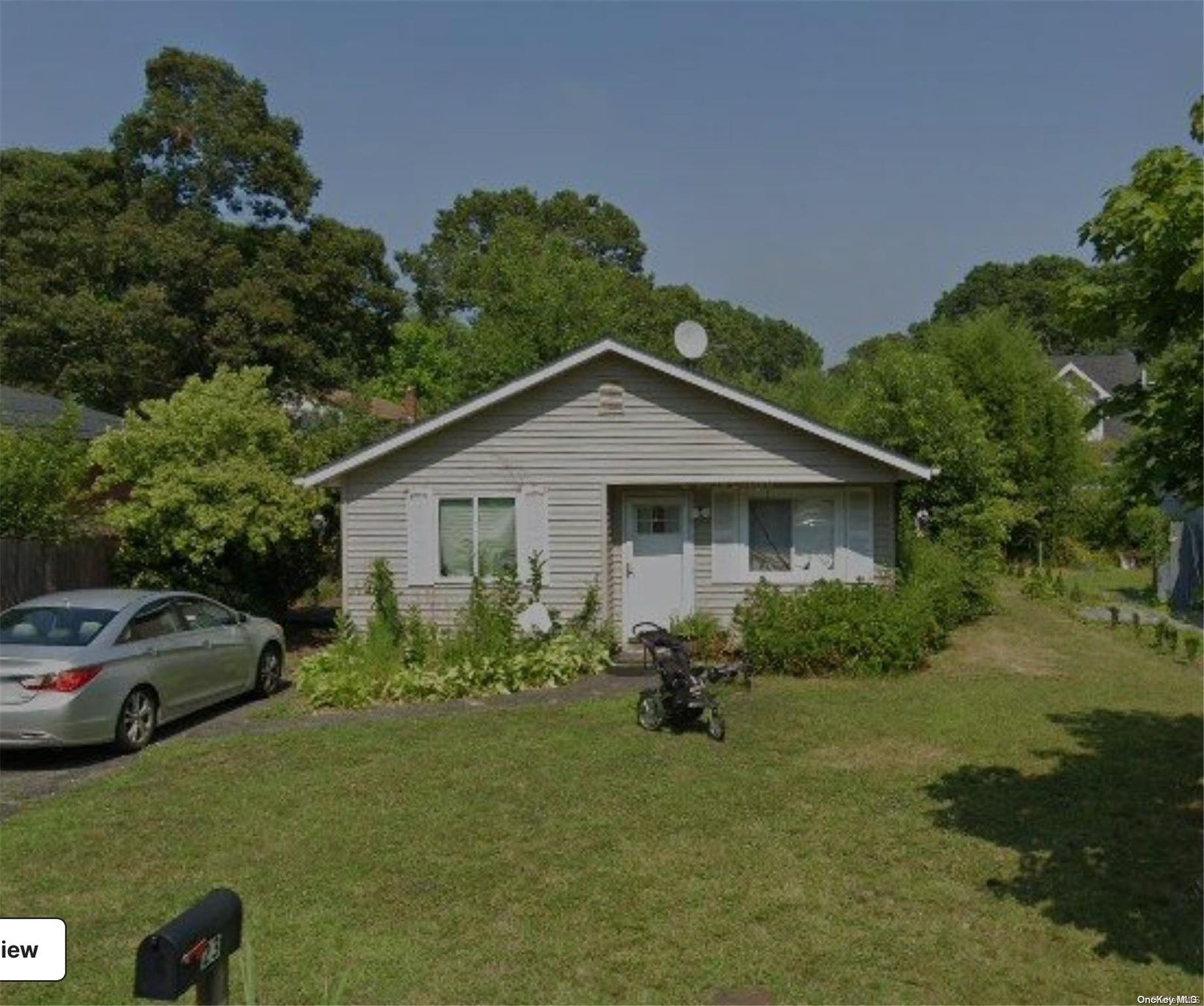 a house view with a garden space