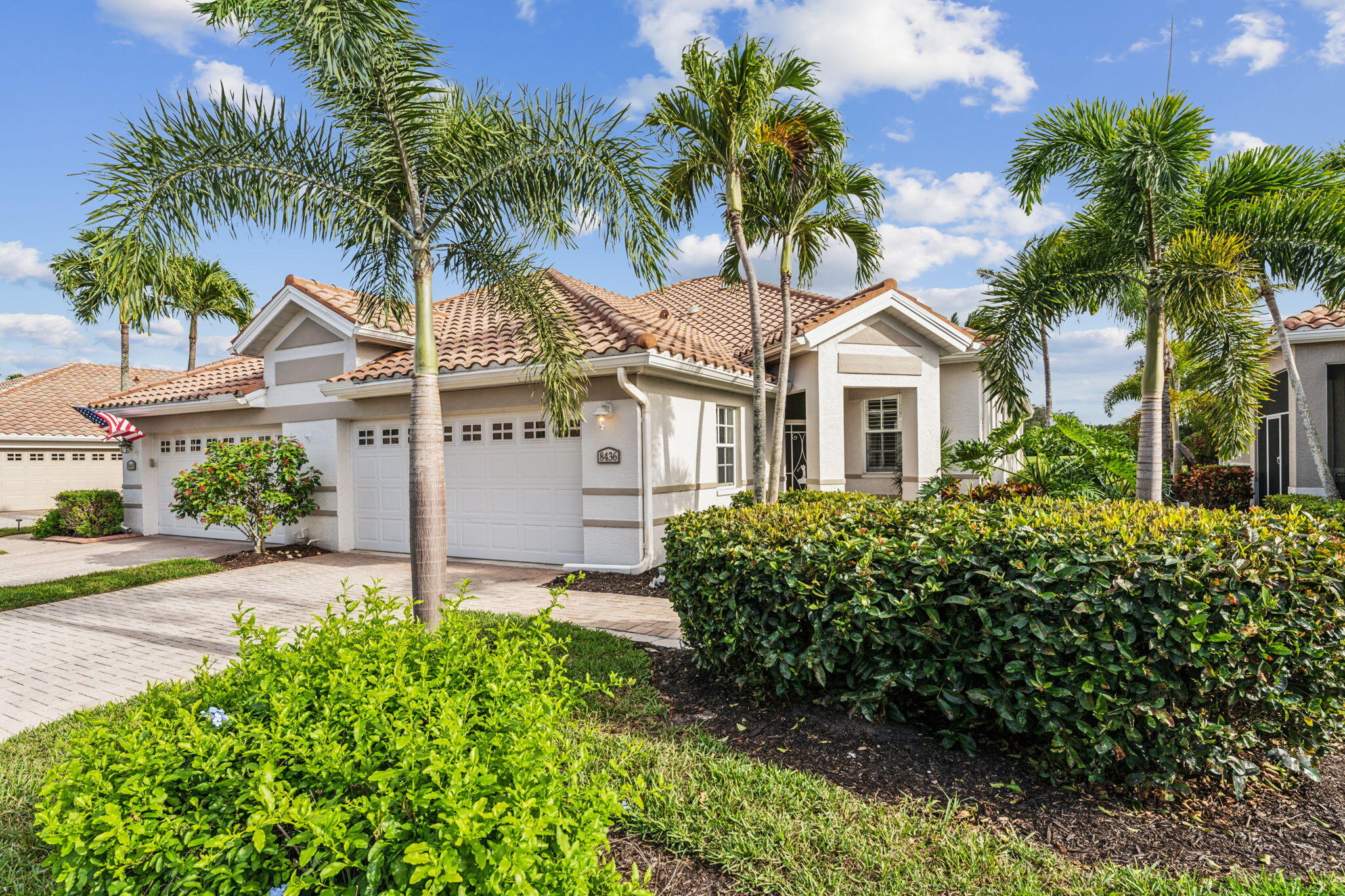 front view of a house with a garden