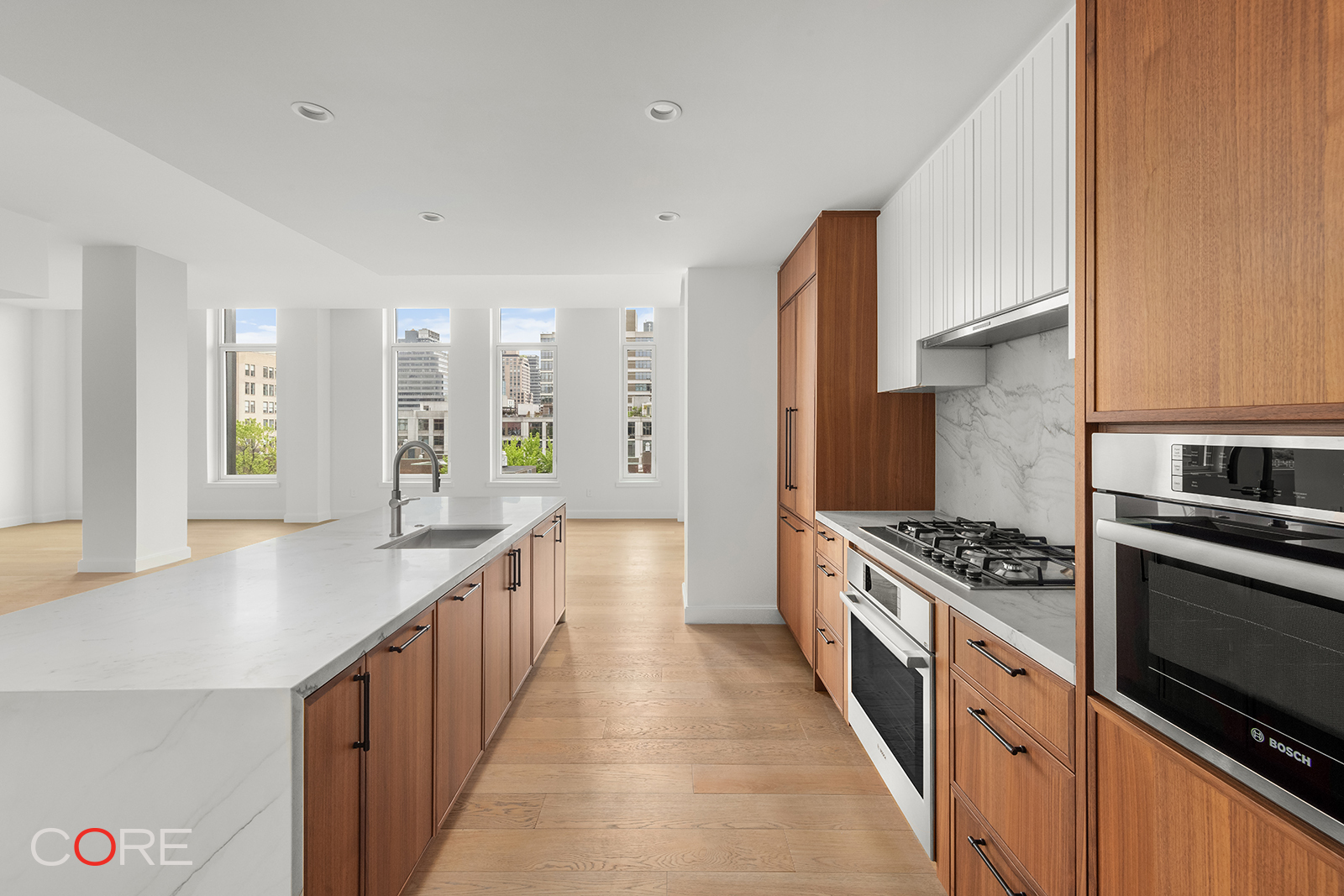 a kitchen with stainless steel appliances a sink and stove