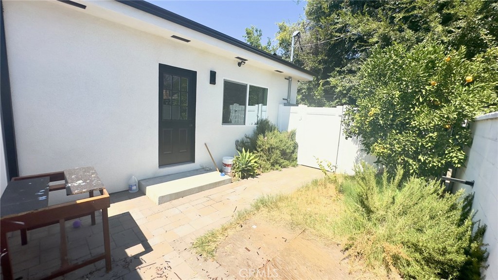 a view of a backyard of the house