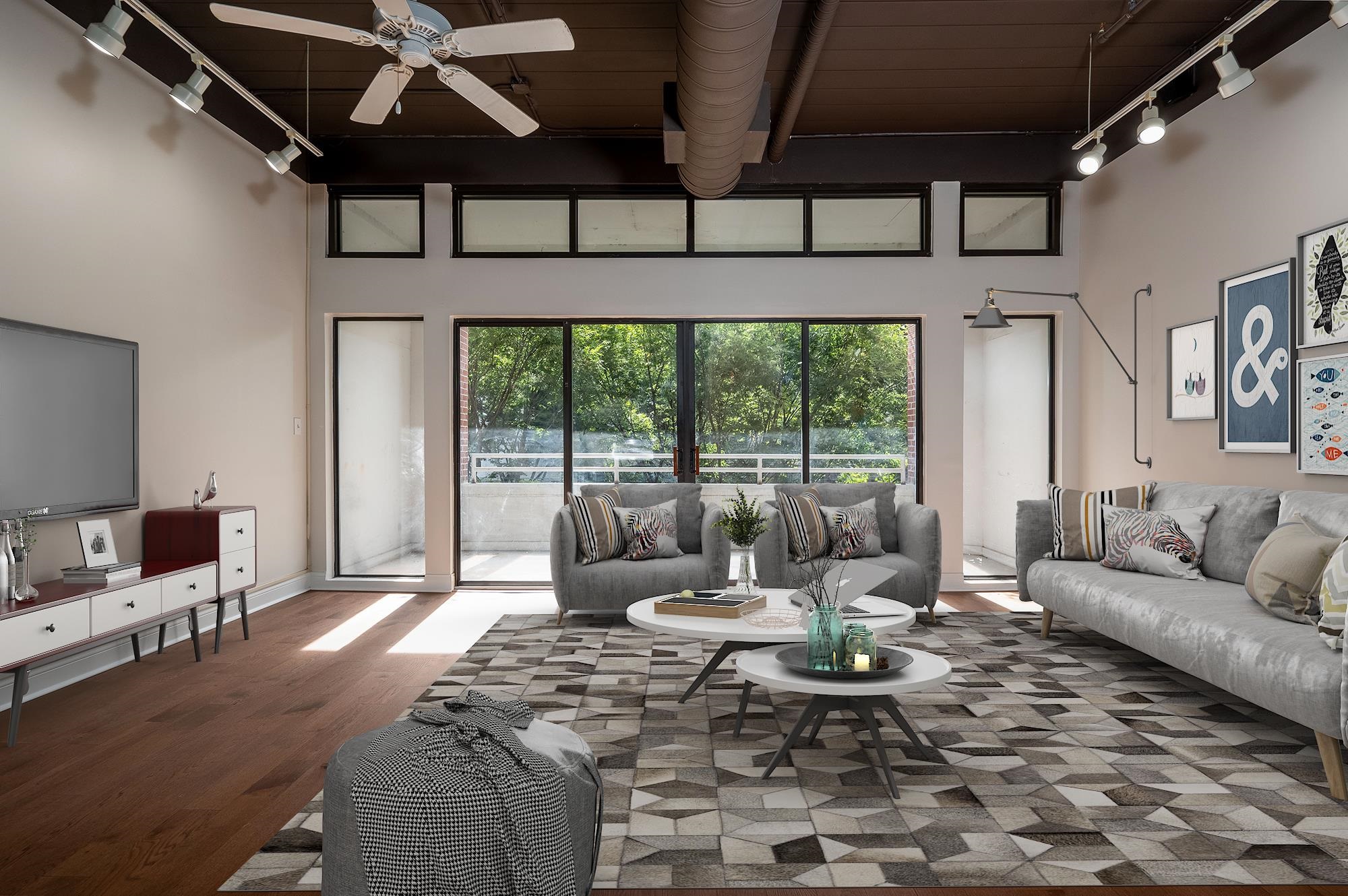 a living room with furniture and a large window