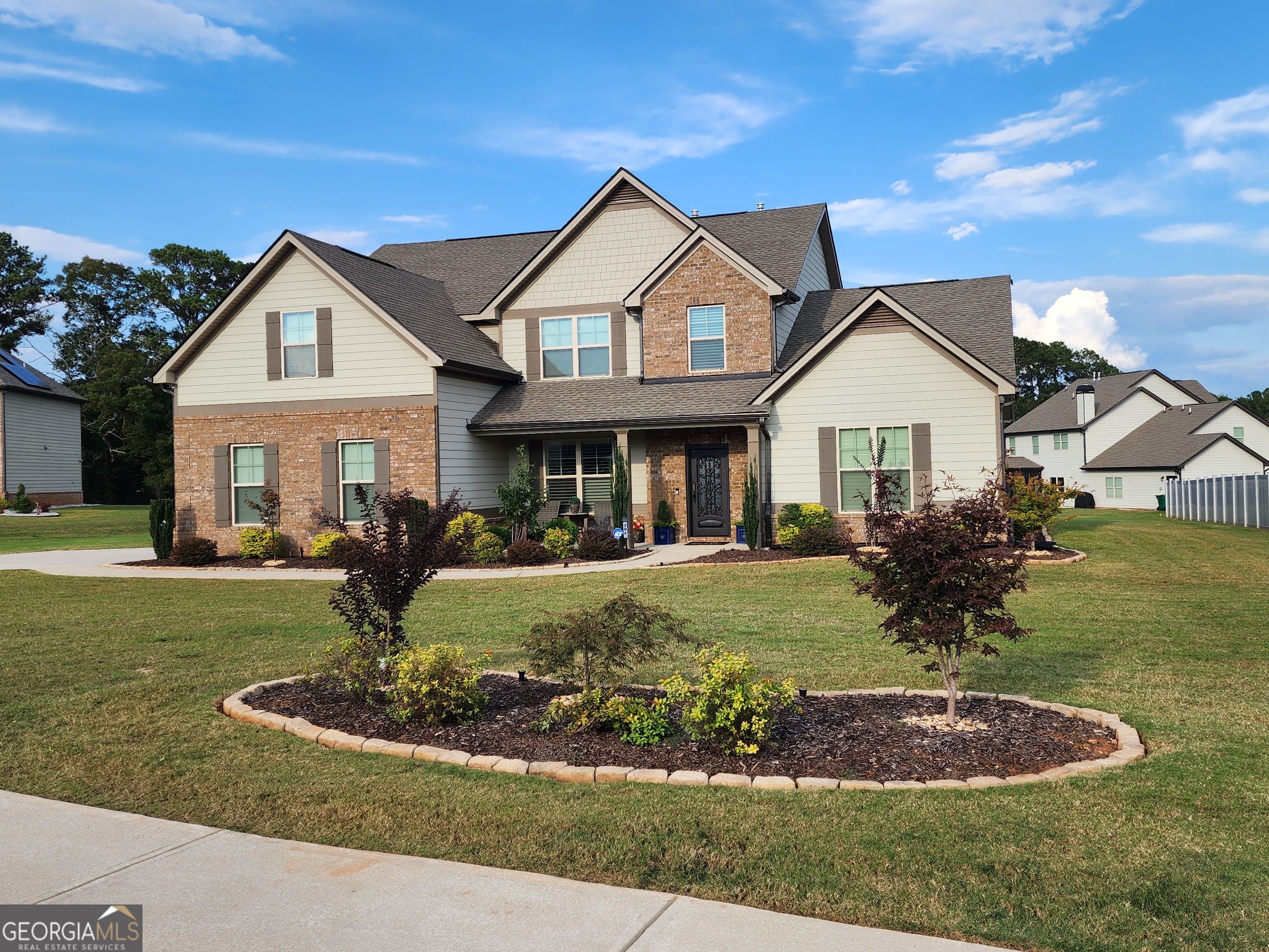 a front view of a house with a yard